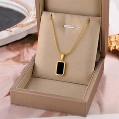 Gold Pendant Necklace with Black Enamel Charm